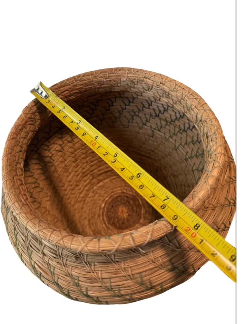 vintage Native American style pine needle basket, similar to those identified